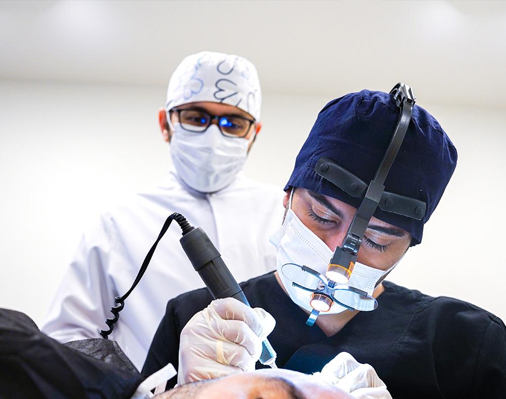 beard transplant doctor operating
