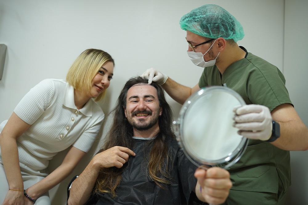 long hair unshaven transplant smiling patient