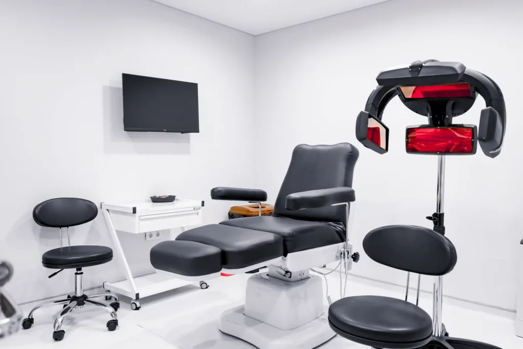 Treatment room with reclining chairs and a laser device